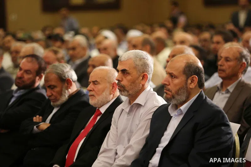 Yahya Sinwar the new leader of the Hamas Islamist movement in the Gaza Strip listens to a speech delivered by Hamas Chief Ismail Haniyeh in Gaza City on July 5, 2017. Haniya said that meetings between his movement and th...