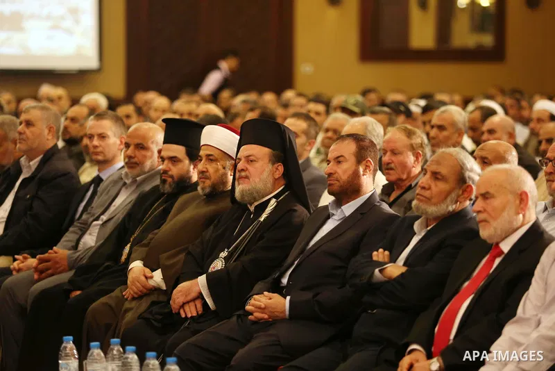 Palestinians listen to a speech delivered by Hamas Chief Ismail Haniyeh in Gaza City on July 5, 2017. Haniya said that meetings between his movement and the Egyptian authorities would ease the siege imposed on the Gaza S...
