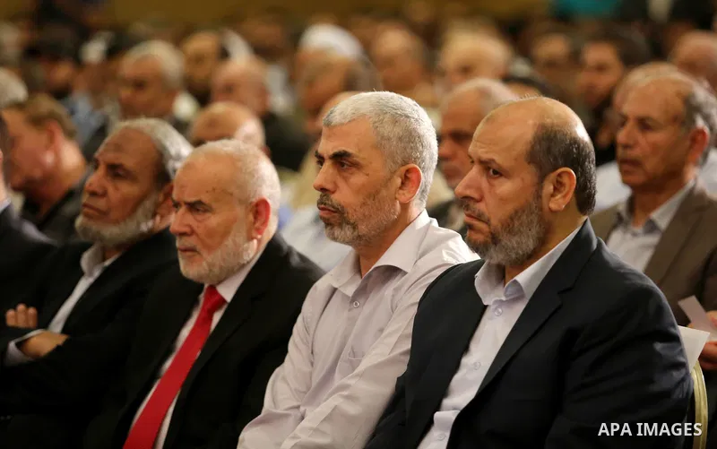 Yahya Sinwar the new leader of the Hamas Islamist movement in the Gaza Strip listens to a speech delivered by Hamas Chief Ismail Haniyeh in Gaza City on July 5, 2017. Haniya said that meetings between his movement and th...
