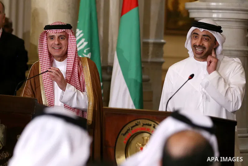 UAE Minister of Foreign Affairs and International Cooperation Abdullah bin Zayed Al-Nahyan talks to reporters as he stands next to Saudi Foreign Minister Adel al-Jubeir, during a joint press conference with their Egyptia...