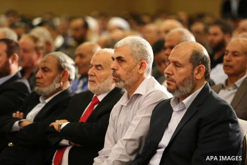 Yahya Sinwar the new leader of the Hamas Islamist movement in the Gaza Strip listens to a speech delivered by Hamas Chief Ismail Haniyeh in Gaza City on July 5, 2017. Haniya said that meetings between his movement and th...