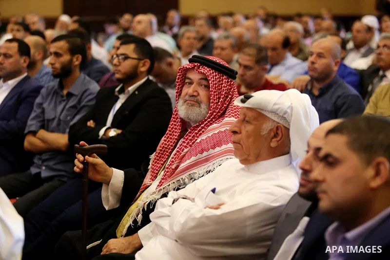 Palestinians listen to a speech delivered by Hamas Chief Ismail Haniyeh in Gaza City on July 5, 2017. Haniya said that meetings between his movement and the Egyptian authorities would ease the siege imposed on the Gaza S...
