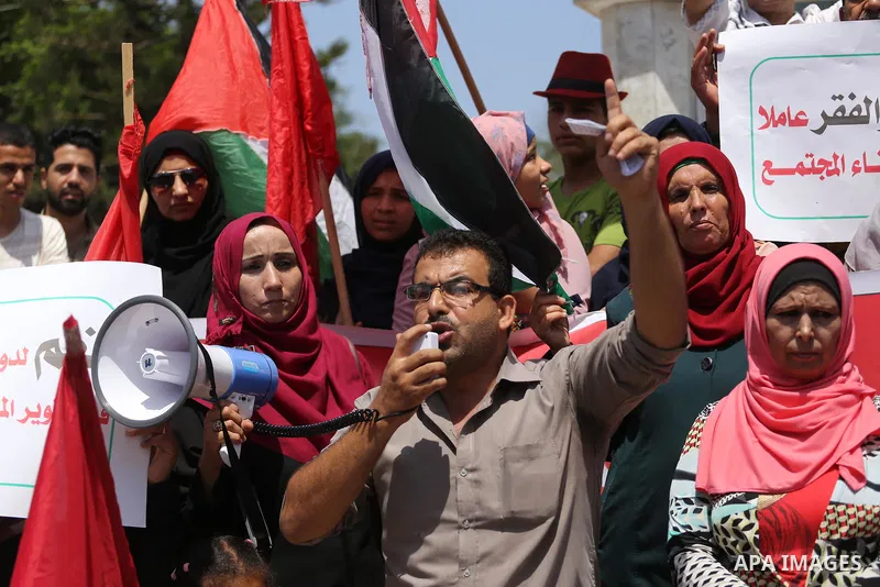 Palestinians take part in a protest against Israeli blockade in Gaza city on July 6, 2017. Photo by Mohammed Asad
