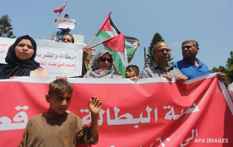 Palestinians take part in a protest against Israeli blockade in Gaza city on July 6, 2017. Photo by Mohammed Asad