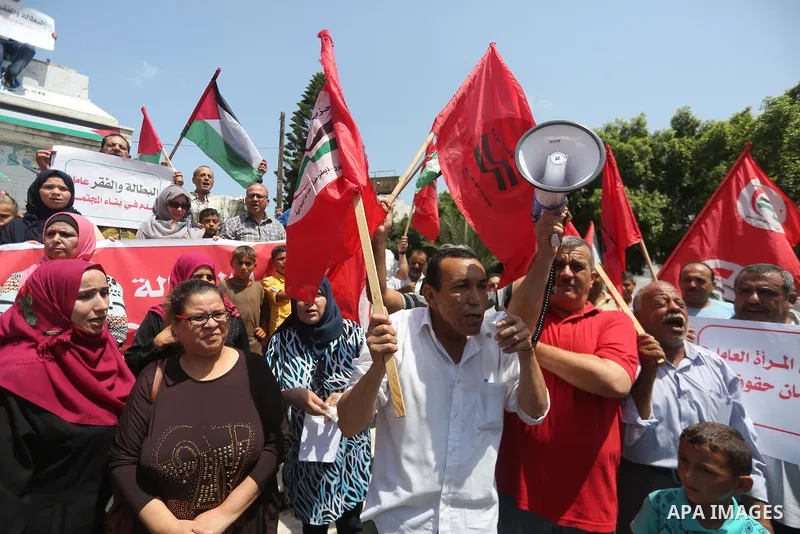 Palestinians take part in a protest against Israeli blockade in Gaza city on July 6, 2017. Photo by Mohammed Asad