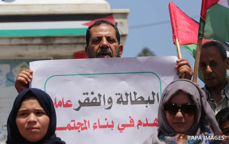Palestinians take part in a protest against Israeli blockade in Gaza city on July 6, 2017. Photo by Mohammed Asad
