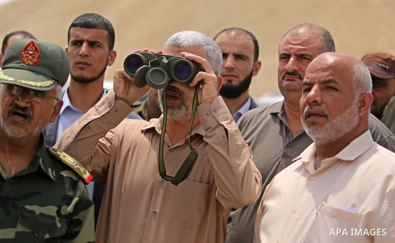 Yahya Sinwar the new leader of the Hamas Islamist movement in the Gaza Strip inspects a section of the border with Egypt, in the southern Gaza strip town of Rafah, on July 6, 2017. The buffer zone is expected to extend f...