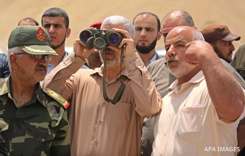 Yahya Sinwar the new leader of the Hamas Islamist movement in the Gaza Strip inspects a section of the border with Egypt, in the southern Gaza strip town of Rafah, on July 6, 2017. The buffer zone is expected to extend f...