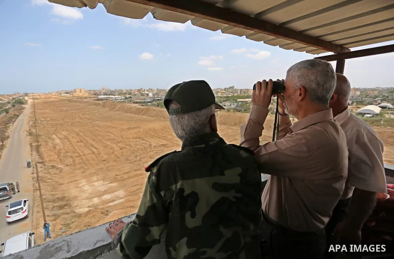Yahya Sinwar the new leader of the Hamas Islamist movement in the Gaza Strip inspects a section of the border with Egypt, in the southern Gaza strip town of Rafah, on July 6, 2017. The buffer zone is expected to extend f...