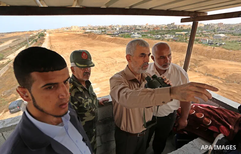 Yahya Sinwar the new leader of the Hamas Islamist movement in the Gaza Strip inspects a section of the border with Egypt, in the southern Gaza strip town of Rafah, on July 6, 2017. The buffer zone is expected to extend f...
