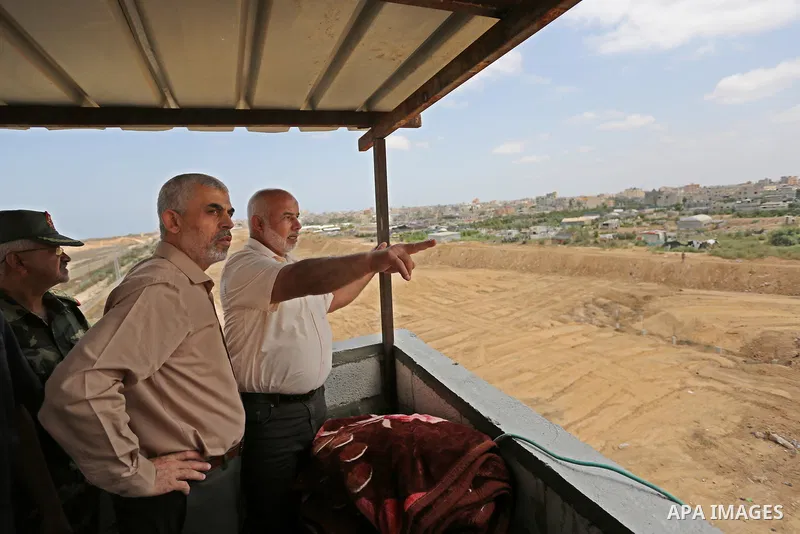 Yahya Sinwar the new leader of the Hamas Islamist movement in the Gaza Strip inspects a section of the border with Egypt, in the southern Gaza strip town of Rafah, on July 6, 2017. The buffer zone is expected to extend f...