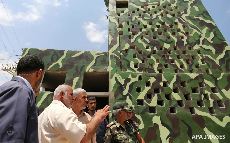 Yahya Sinwar the new leader of the Hamas Islamist movement in the Gaza Strip inspects a section of the border with Egypt, in the southern Gaza strip town of Rafah, on July 6, 2017. The buffer zone is expected to extend f...