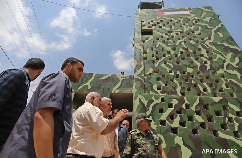 Yahya Sinwar the new leader of the Hamas Islamist movement in the Gaza Strip inspects a section of the border with Egypt, in the southern Gaza strip town of Rafah, on July 6, 2017. The buffer zone is expected to extend f...