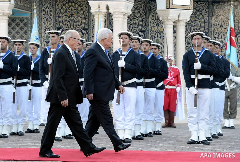 Tunisian President Beji Caid Essebsi reviews the honours guard with Palestinian President Mahmoud Abbas during a welcome ceremony at Carthage Palace, near Tunis, on July 6, 2017. Abbas is on 2 day official visit to Tunis...