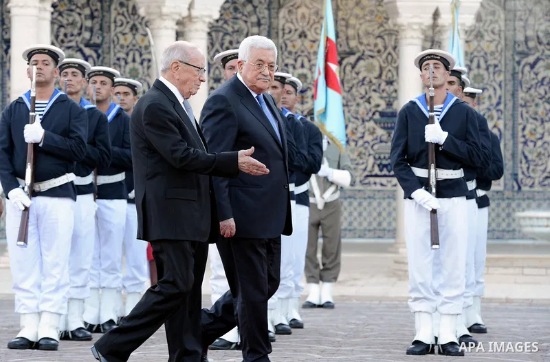 Tunisian President Beji Caid Essebsi reviews the honours guard with Palestinian President Mahmoud Abbas during a welcome ceremony at Carthage Palace, near Tunis, on July 6, 2017. Abbas is on 2 day official visit to Tunis...