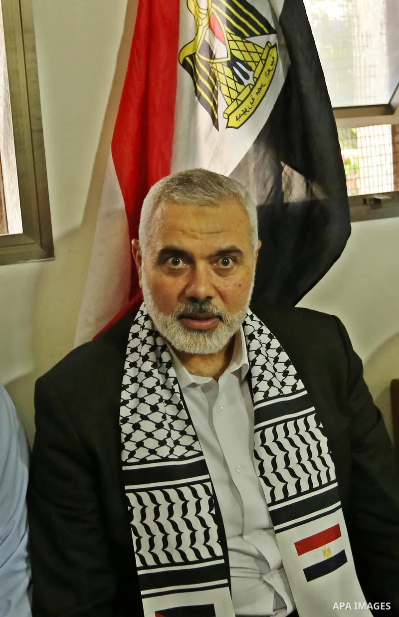 Hamas leader Ismail Haniya (C) arrives to a mourning tent in Gaza City on July 8, 2017 set up for people to pay their respects to the Egyptian soldiers, who were killed a day earlier in the restive Sinai Peninsula in an...