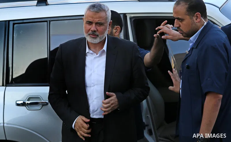 Hamas leader Ismail Haniya (C) arrives to a mourning tent in Gaza City on July 8, 2017 set up for people to pay their respects to the Egyptian soldiers, who were killed a day earlier in the restive Sinai Peninsula in an...