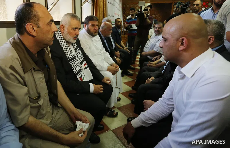 Hamas leader Ismail Haniya (C) arrives to a mourning tent in Gaza City on July 8, 2017 set up for people to pay their respects to the Egyptian soldiers, who were killed a day earlier in the restive Sinai Peninsula in an...