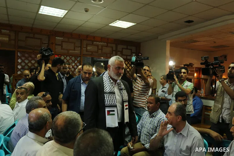 Hamas leader Ismail Haniya (C) arrives to a mourning tent in Gaza City on July 8, 2017 set up for people to pay their respects to the Egyptian soldiers, who were killed a day earlier in the restive Sinai Peninsula in an...