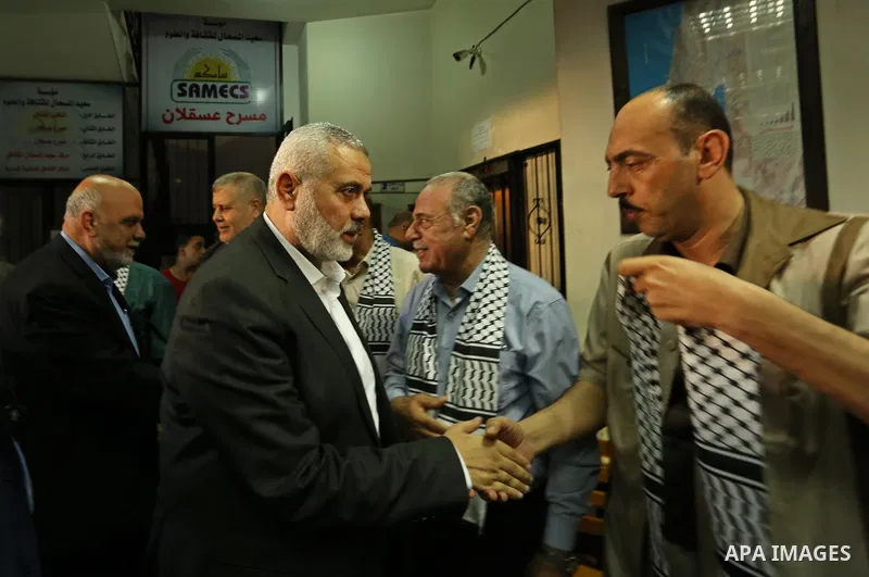 Hamas leader Ismail Haniya (C) arrives to a mourning tent in Gaza City on July 8, 2017 set up for people to pay their respects to the Egyptian soldiers, who were killed a day earlier in the restive Sinai Peninsula in an...