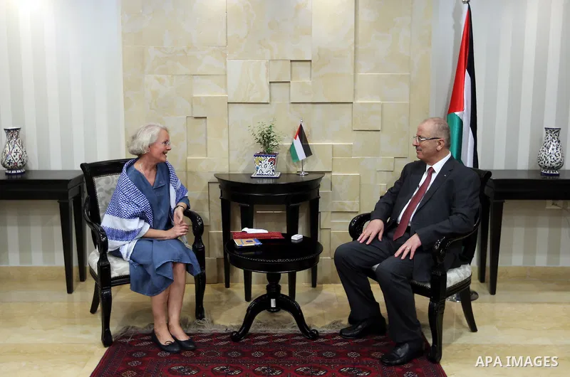 Palestinian Prime Minister Rami Hamdallah meets with the representative of Finland to Palestine, Pericolisa Costella, at his office in the West Bank city of Ramallah, on July 09, 2017. Photo by Prime Minister Office