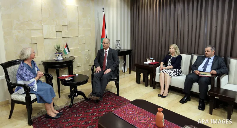 Palestinian Prime Minister Rami Hamdallah meets with the representative of Finland to Palestine, Pericolisa Costella, at his office in the West Bank city of Ramallah, on July 09, 2017. Photo by Prime Minister Office