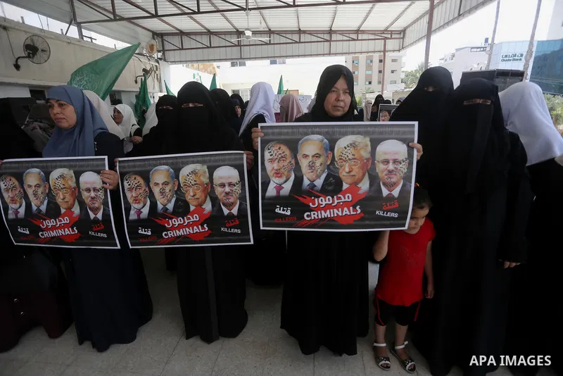 Palestinian women hold placards during a protest against Israeli blockade at Legislative council in Gaza city on July 9, 2017. Photo by Mohammed Asad