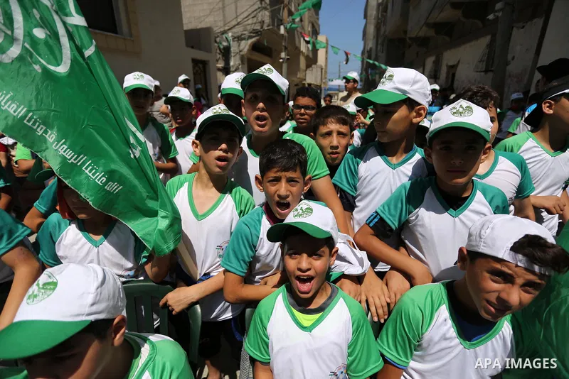 Palestinian children attend the start ceremony of summer camps organized by the Hamas movement in Gaza city on July 9, 2017. Photo by Ashraf Amra