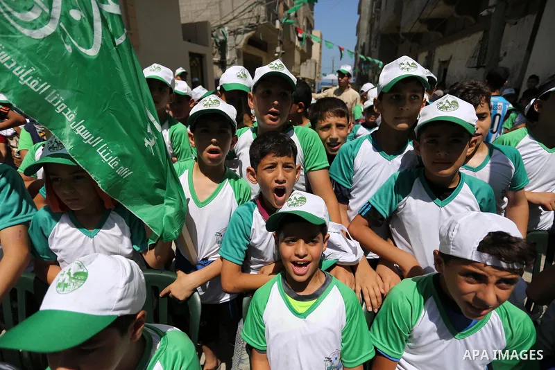 Palestinian children attend the start ceremony of summer camps organized by the Hamas movement in Gaza city on July 9, 2017. Photo by Ashraf Amra