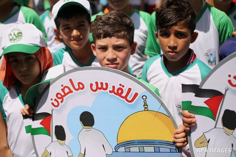 Palestinian children attend the start ceremony of summer camps organized by the Hamas movement in Gaza city on July 9, 2017. Photo by Ashraf Amra