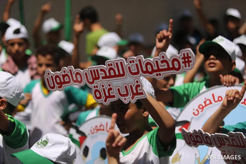 Palestinian children attend the start ceremony of summer camps organized by the Hamas movement in Gaza city on July 9, 2017. Photo by Ashraf Amra
