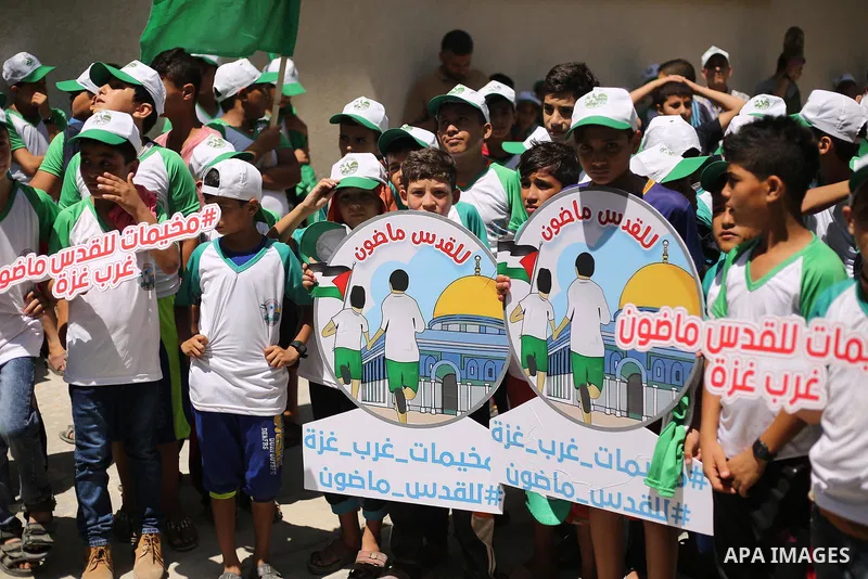 Palestinian children attend the start ceremony of summer camps organized by the Hamas movement in Gaza city on July 9, 2017. Photo by Ashraf Amra