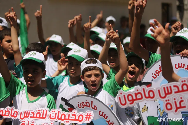 Palestinian children attend the start ceremony of summer camps organized by the Hamas movement in Gaza city on July 9, 2017. Photo by Ashraf Amra