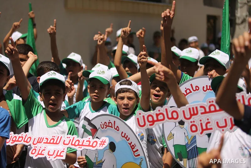 Palestinian children attend the start ceremony of summer camps organized by the Hamas movement in Gaza city on July 9, 2017. Photo by Ashraf Amra