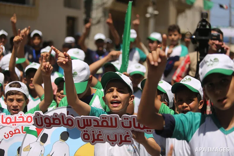 Palestinian children attend the start ceremony of summer camps organized by the Hamas movement in Gaza city on July 9, 2017. Photo by Ashraf Amra