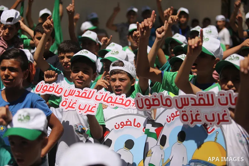 Palestinian children attend the start ceremony of summer camps organized by the Hamas movement in Gaza city on July 9, 2017. Photo by Ashraf Amra