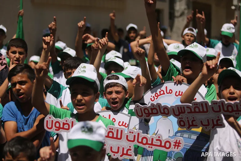 Palestinian children attend the start ceremony of summer camps organized by the Hamas movement in Gaza city on July 9, 2017. Photo by Ashraf Amra