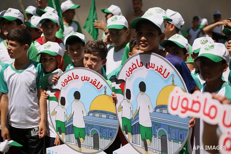 Palestinian children attend the start ceremony of summer camps organized by the Hamas movement in Gaza city on July 9, 2017. Photo by Ashraf Amra