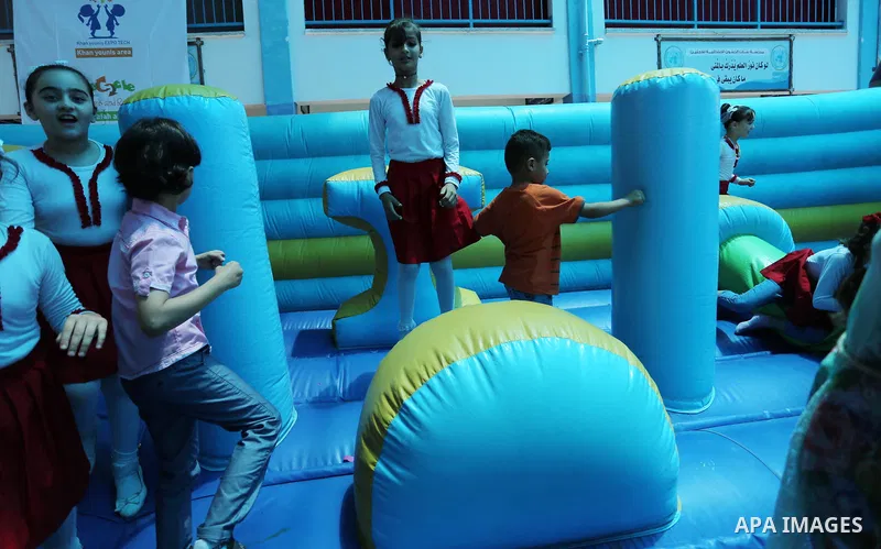 Palestinians enjoy as part of the activities proposed during a Summer Fun Weeks 2017 organised by the United Nations, in Gaza city, on July 9, 2017. Photo by Ashraf Amra