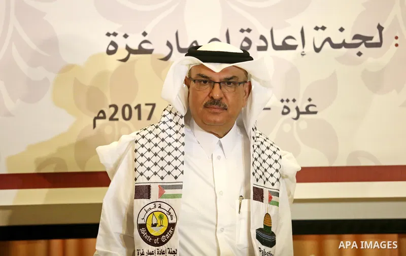 Qatar's Ambassador to the Palestinian Authority, Mohammed Al Emadi, delivers financial payments to the project to repair the homes of poor families, in Gaza city on July 10, 2017. Photo by Ashraf Amra