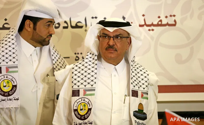 Qatar's Ambassador to the Palestinian Authority, Mohammed Al Emadi, delivers financial payments to the project to repair the homes of poor families, in Gaza city on July 10, 2017. Photo by Ashraf Amra