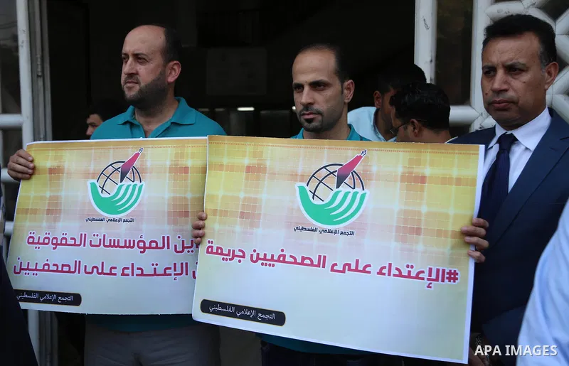 Palestinian journalists take part in a protest against the decision of Palestinian Authority's public prosecutor to block 11 Palestinian news websites in the Israeli-occupied West Bank, in Gaza city on July 10, 2017. Pho...