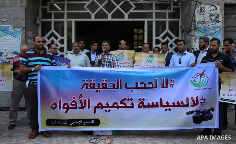 Palestinian journalists take part in a protest against the decision of Palestinian Authority's public prosecutor to block 11 Palestinian news websites in the Israeli-occupied West Bank, in Gaza city on July 10, 2017. Pho...