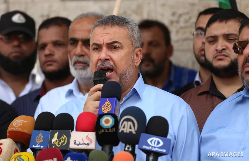 Senior Hamas Leader Ismail Redwan, speaks during a protest against israeli attacks on Palestinian female prisoners in Israeli jails, in front of Red cross office in Gaza city on July 11, 2017. Photo by Ashraf Amra