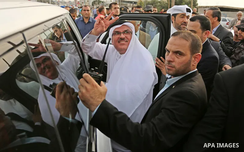 Qatar's Ambassador to the Palestinian Authority, Mohammed Al Emadi leaves following the opening ceremony of rebuild Salah Al-Deen street project -Phase IV- funded by Qatar in al-Nusairat in the center of Gaza strip, on J...