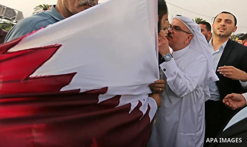 Qatar's Ambassador to the Palestinian Authority, Mohammed Al Emadi kisses a Palestinian girl during the opening ceremony of rebuild Salah Al-Deen street project -Phase IV- funded by Qatar in al-Nusairat in the center of...