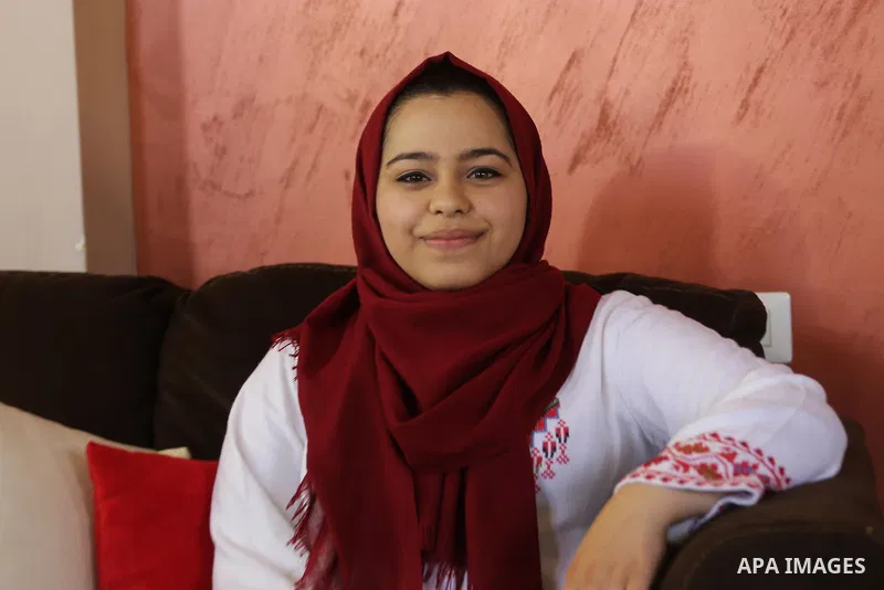A Palestinian high school student, Malak Matar 99.3, poses for a photo after heard the results of her final exams known as ''Tawjihi'', in Gaza city on July 12, 2017. Photo by Mohammed Asad