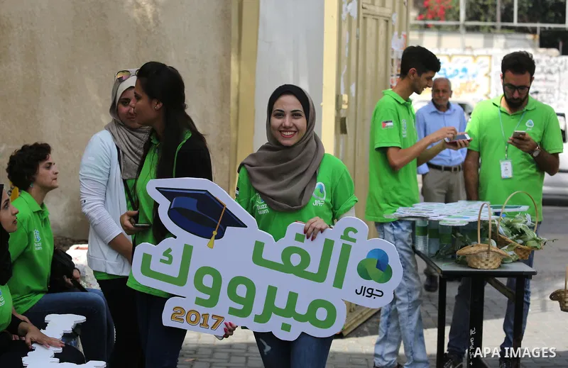 Palestinians celebrate after heard the results of final exams known as "Tawjihi", in Gaza city on July 12, 2017. Photo by Ashraf Amra