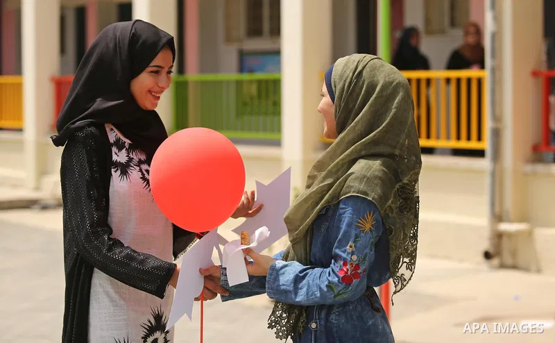 Palestinian high school female students celebrate after heard their results of final exams known as "Tawjihi", in Gaza city on July 12, 2017. Photo by Ashraf Amra