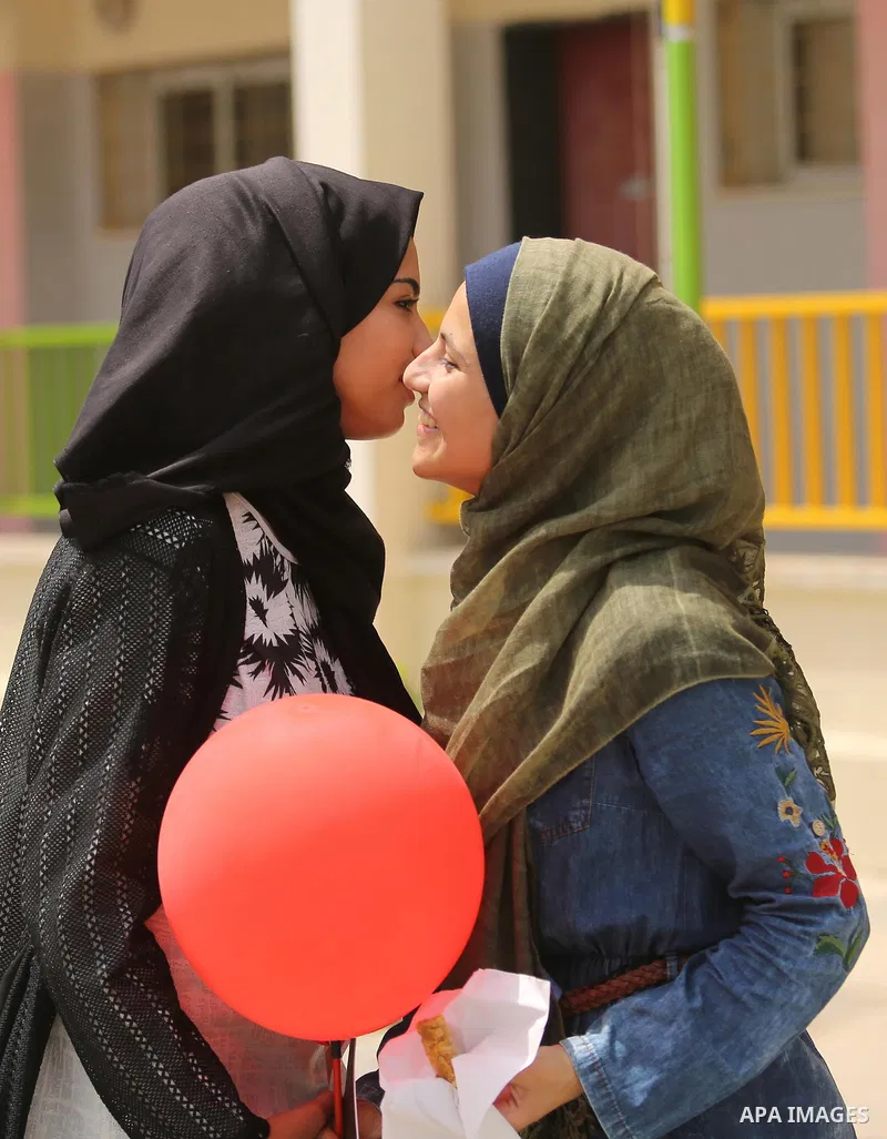 Palestinian high school female students celebrate after heard their results of final exams known as "Tawjihi", in Gaza city on July 12, 2017. Photo by Ashraf Amra